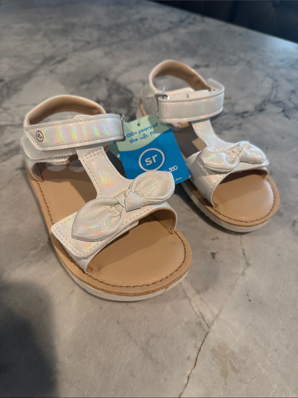 Stride Rite Girls' Iridescent Frida White Bow Sandals